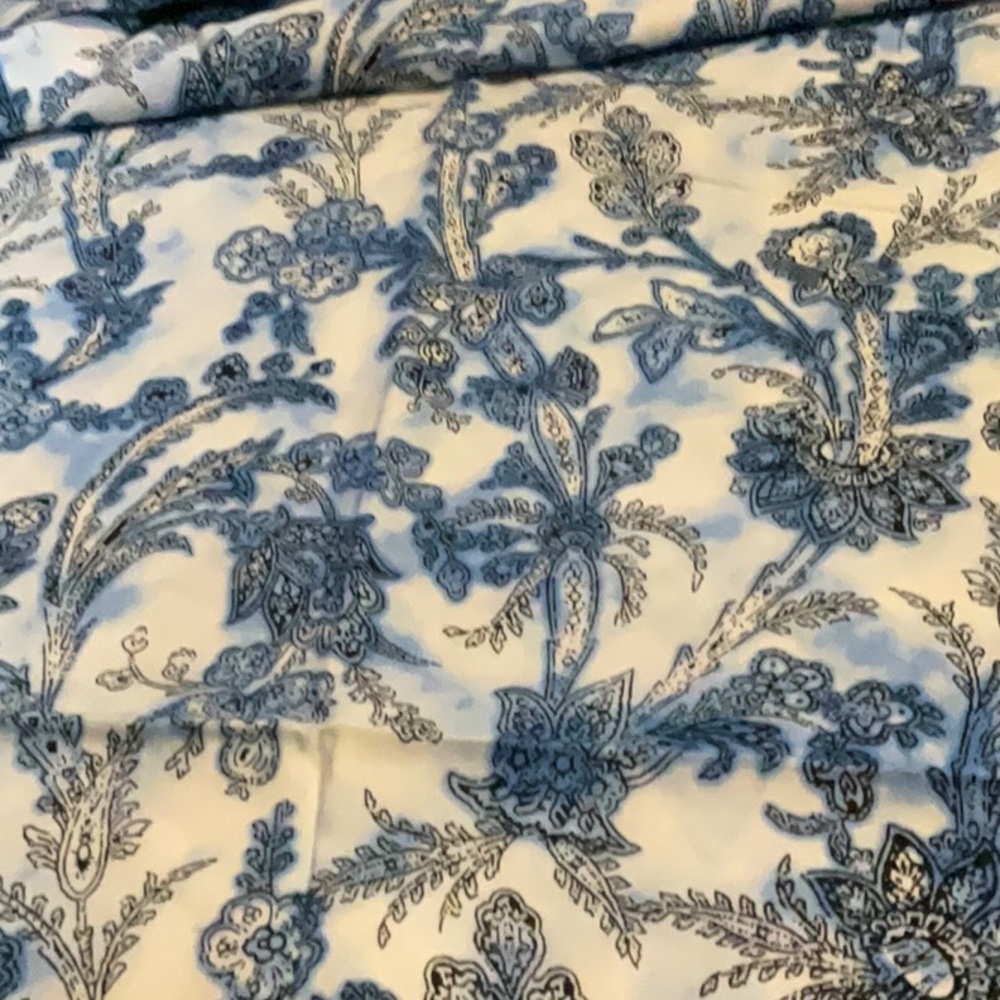 Blues,white and black make this a lovely piece of fabric. Polyester/ cotton feel